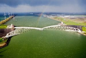The Maeslantkering, the fifth and last storm surge barrier to be built in the Netherlands, guards the Port of Rotterdam, the busiest port in Europe.